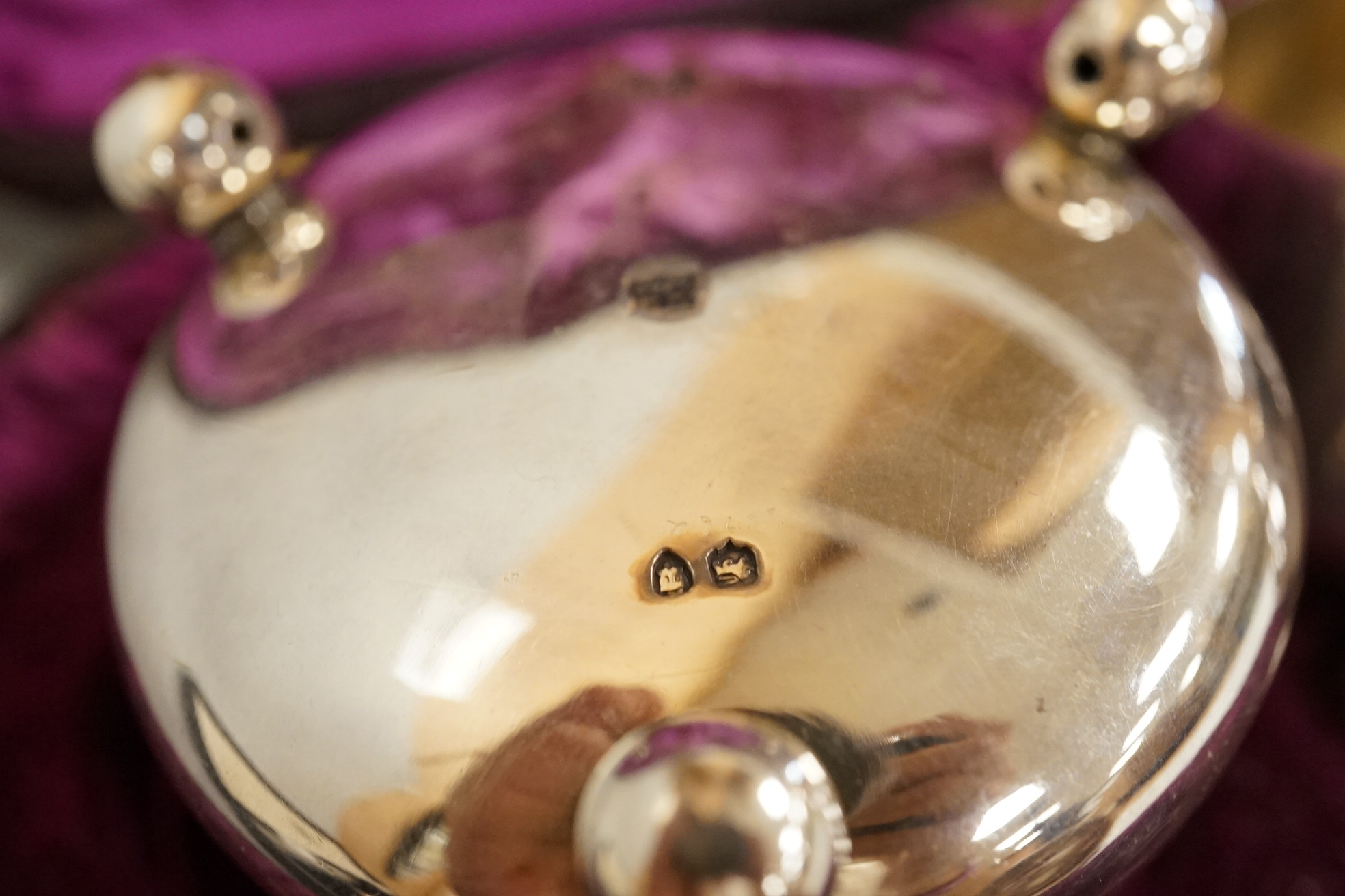 A cased pair of Victorian silver circular salts, by Edward Hutton, London, 1886, lacking spoons, together with a cased set of six silver bean end coffee spoons, a cased silver spoon, a small silver 'Dunlop Golf Ball Hole